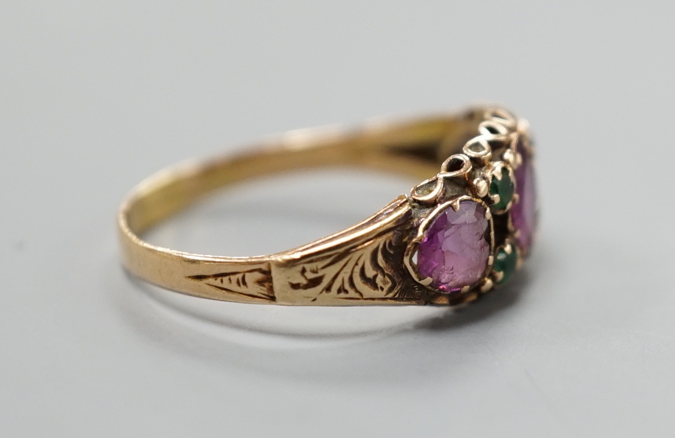 A Victorian gold, garnet? and emerald set half hoop ring, size N, gross weight 1.8 grams.